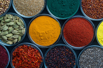 Assortment colorful spices, seeds and herbs for cooking food, top view