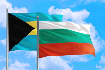 Bulgaria and Bahamas national flag waving in the windy deep blue sky. Diplomacy and international relations concept.