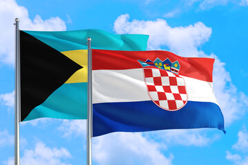 Croatia and Bahamas national flag waving in the windy deep blue sky. Diplomacy and international relations concept.