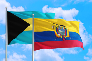 Ecuador and Bahamas national flag waving in the windy deep blue sky. Diplomacy and international relations concept.
