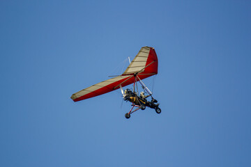 Fototapeta na wymiar Motor Glider in the blue sky