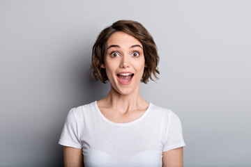 Portrait of young excited beautiful charming woman girl female look in camera with open mouth...