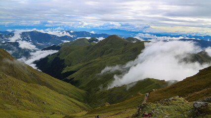 Himalayan landscape with mountain valleys clouds. The Himalayan range is one of the youngest mountain ranges on the planet and consists mostly of uplifted sedimentary and metamorphic rock.