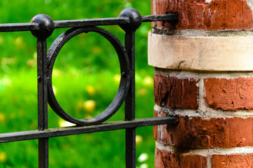 Fragment of cast-iron fence in the park - artistic metal casting. 3