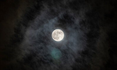Naklejka na ściany i meble Full moon with fog and cloudy. The moon was not furnished. The night sky and a full moon in the clouds.