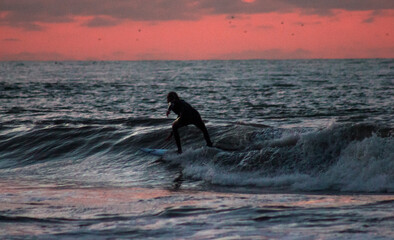 Fototapeta premium surfer at sunset