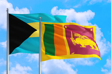 Sri Lanka and Bahamas national flag waving in the windy deep blue sky. Diplomacy and international relations concept.