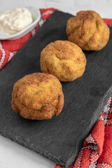 Homemade croquettes stuffed with broccoli and Parmesan cheese