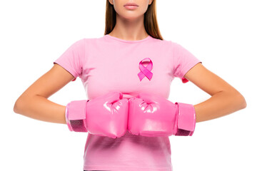 Cropped view of woman in boxing gloves and pink ribbon of breast cancer awareness on t-shirt isolated on white