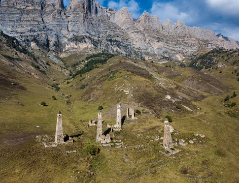 Aerial view of medieval ancient stone battle tower complex in the mountains of Ingushetia, Russia