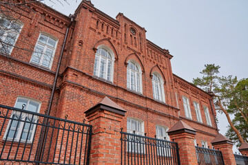 old majestic red brick building in the gothic style