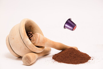red purple capsule flying in the air, with wooden mortars and wooden bowl, mountain of coffee, on white background