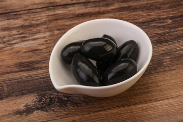 Pickled black olives in the bowl