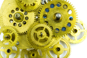 Gears of the old mechanism from bronze on a white background.