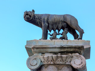 Bronze sculpture of a she-wolf breastfeeding two babies, Romulus and Remus, the symbol of Rome.
