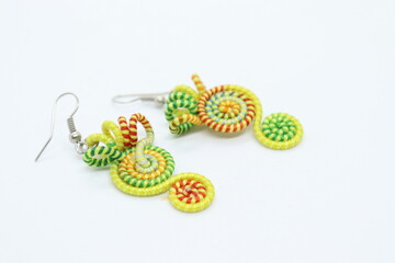 Earrings made by knitting with colored threads