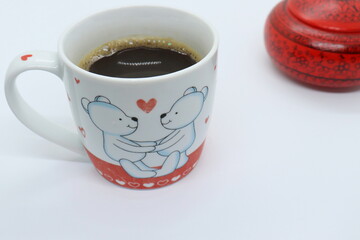 Coffee in mug with teddy bear and heart on it, valentine