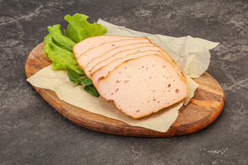 Boiled pork sausage over board