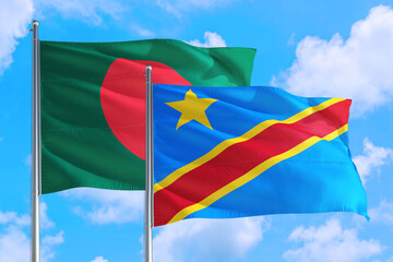 Congo and Bangladesh national flag waving in the windy deep blue sky. Diplomacy and international relations concept.