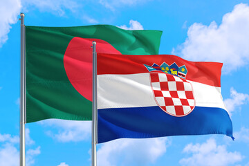 Croatia and Bangladesh national flag waving in the windy deep blue sky. Diplomacy and international relations concept.