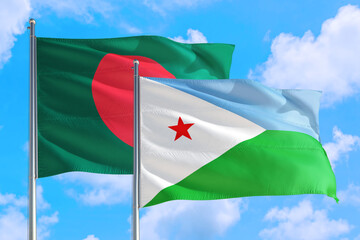 Djibouti and Bangladesh national flag waving in the windy deep blue sky. Diplomacy and international relations concept.