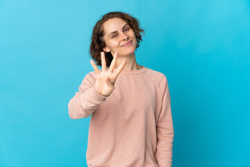 Young English woman isolated on blue background happy and counting four with fingers