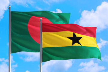 Ghana and Bangladesh national flag waving in the windy deep blue sky. Diplomacy and international relations concept.