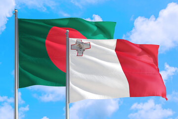 Malta and Bangladesh national flag waving in the windy deep blue sky. Diplomacy and international relations concept.