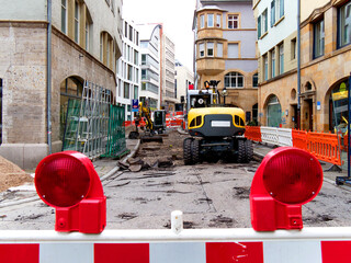 Road construction works in Stuttgart city centre with barrier in the foreground