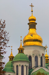 Fototapeta na wymiar Close-up view of ancient Saint Sophia Cathedral in Kyiv. UNESCO World Heritage Site. Christian Orthodox cathedral. Famous touristic place and travel destination in Kyiv. Cloudy autumn morning