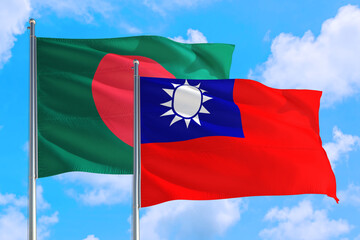 Taiwan and Bangladesh national flag waving in the windy deep blue sky. Diplomacy and international relations concept.