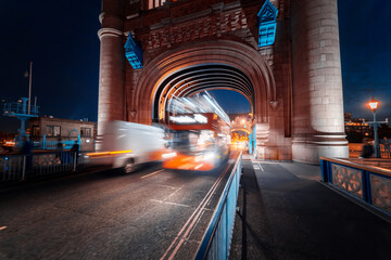 night view of Tower Bridge traffic, London, UK