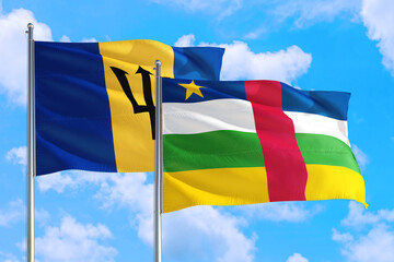 Central African Republic and Barbados national flag waving in the windy deep blue sky. Diplomacy and international relations concept.