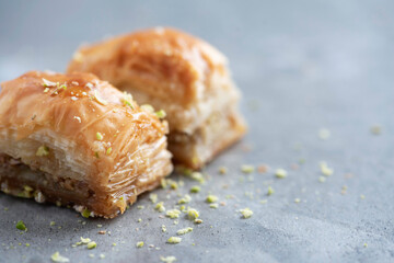 Turkish dessert chocolate baklava on grey background. Top view. Copy space. Set of assorted traditional eastern desserts. Arabian sweets, turkish delight.