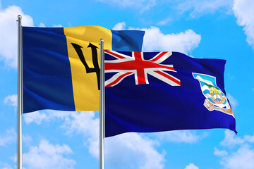 Fototapeta premium Falkland Islands and Barbados national flag waving in the windy deep blue sky. Diplomacy and international relations concept.
