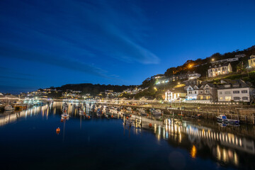 Fototapeta na wymiar Looe Harbour in the evening, Looe is a seaside Town and fishing port in Cornwall, UK