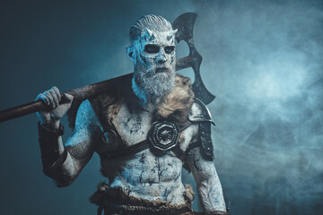 Nordic and mystical fashion undead dressed in dark armour with white hairs and skin holding two...