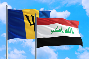 Iraq and Barbados national flag waving in the windy deep blue sky. Diplomacy and international relations concept.
