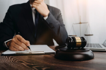Business and lawyers discussing contract papers with brass scale on desk in office. Law, legal...