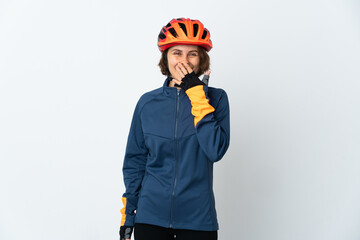 Young English cyclist woman isolated on white background happy and smiling covering mouth with hand
