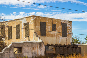 Abandoned Two Story Building With Boarded Up Windows