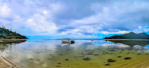 Beautiful panoramic shot from the Seychelles Beach on a sunny day with a clear horizon