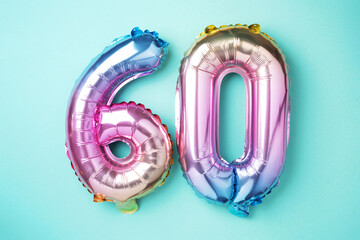 Rainbow foil balloon number, digit sixty. Birthday greeting card with inscription 60. Anniversary...