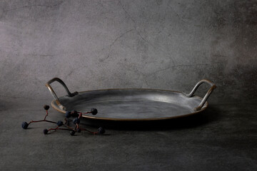 Abstract minimal scene with old metal dish on black background. Metalic plate podium for product presentation. 3d rendering.