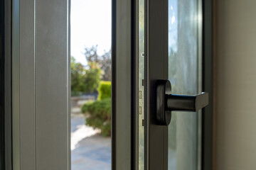 Aluminum door window closeup view, blurry background