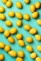 Immune system booster. Fresh lemons pattern on blue background. Copy space. Top view. Flat lay. Citrus fruits. Vitamins for health. Liposomal vitamin C. Lemon for vegan, vegetarian alkaline diet