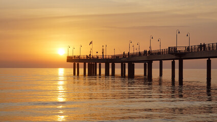Fototapeta na wymiar pier in a yellow sunset