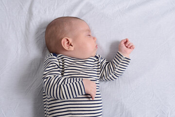 the baby lying and sleeping