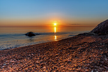 Sunset on the lake in summer, Pskov region