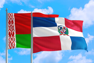 Dominican Republic and Belarus national flag waving in the windy deep blue sky. Diplomacy and international relations concept.